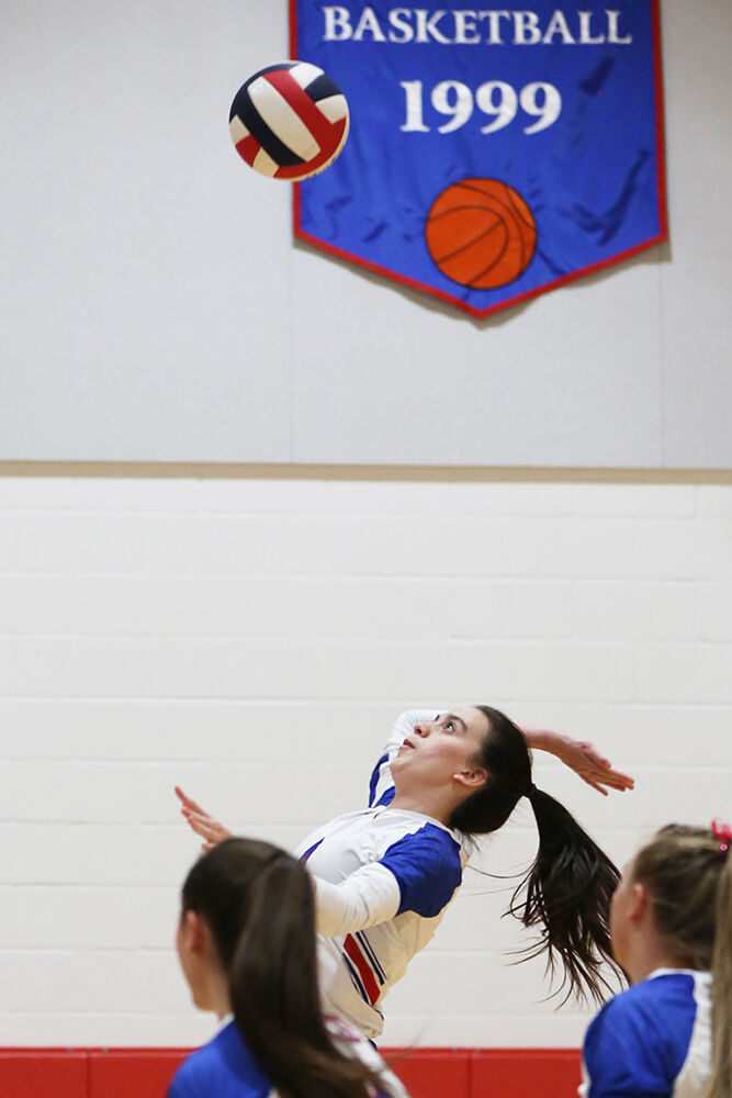 Karcee Maya jumps to make a hit during the first set against Midwest
